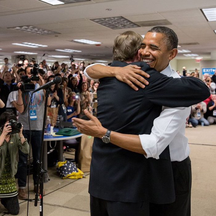 Photo of Jim Messina hugging President Obama